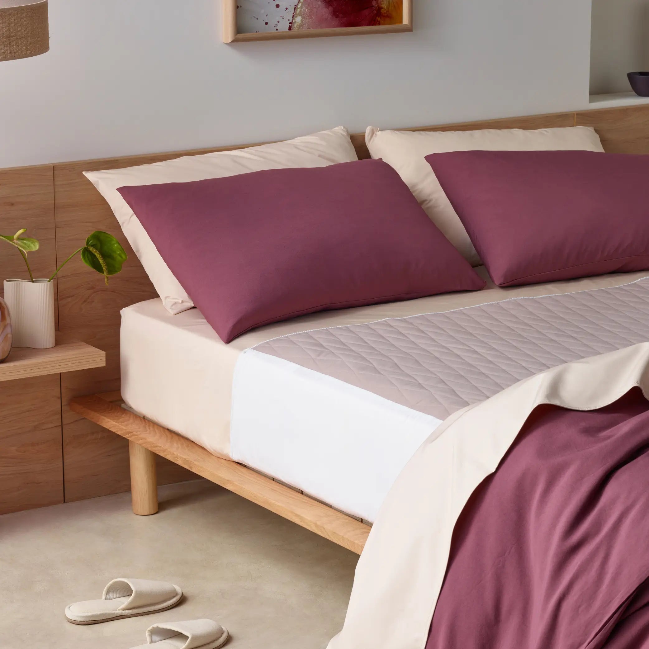 Elegant incontinence-friendly bedding set with a quilted waterproof mattress protector for ultimate comfort and protection. Featuring breathable sheets in a soft beige tone with deep cacao-coloured pillowcases and duvet cover. Hypoallergenic, machine-washable, and discreetly designed for all-night dryness, this stylish bedding set offers a luxurious yet functional sleep solution.
