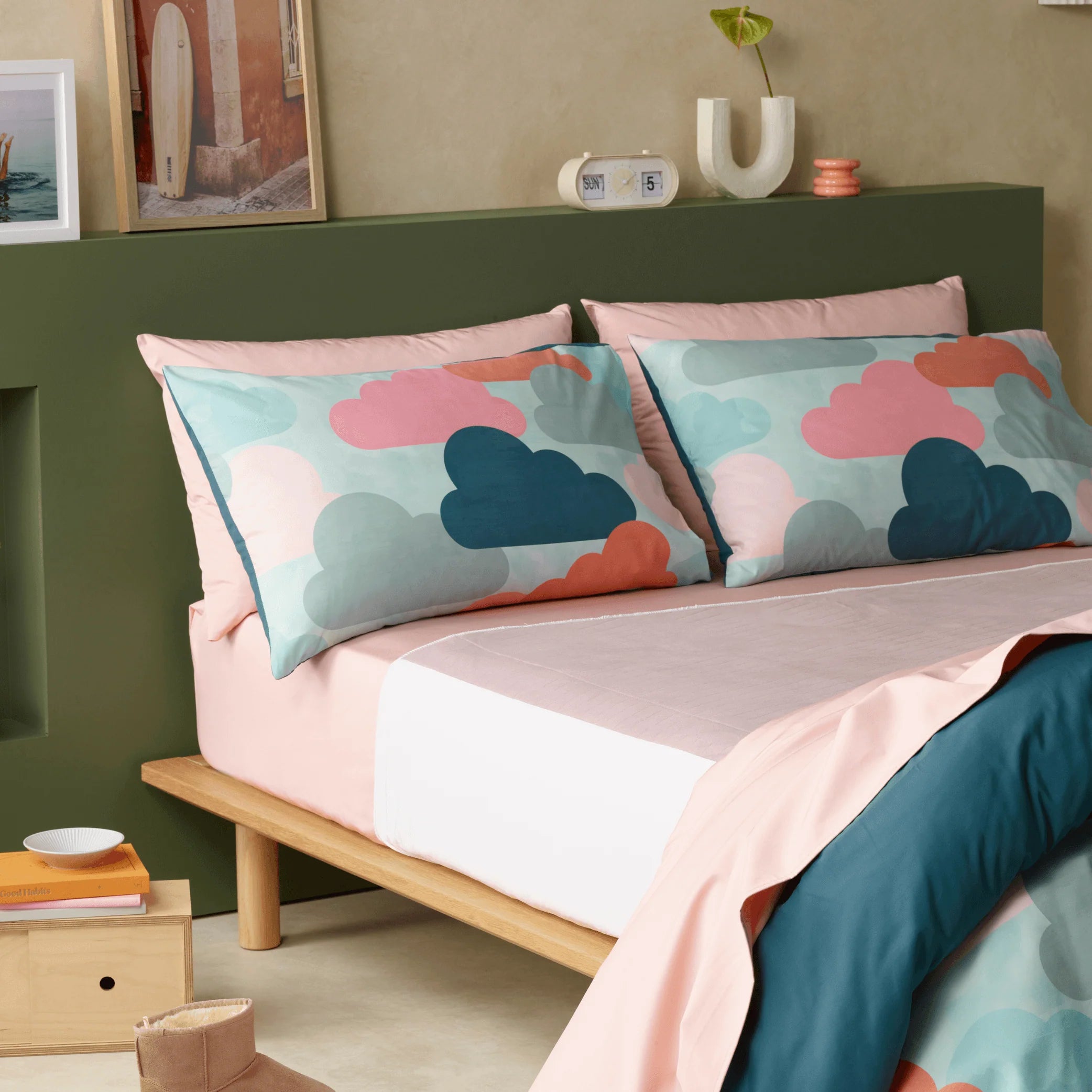 Luxury incontinence friendly bedding set with waterproof sheets in soft blush and deep teal. Featuring a modern cloud-print pillowcase design, stylish and ultra-absorbent bed set offers superior comfort, durability, and discreet protection for uninterrupted sleep. Ideal for those seeking breathable, hypoallergenic, and machine-washable bed linens for incontinence care.