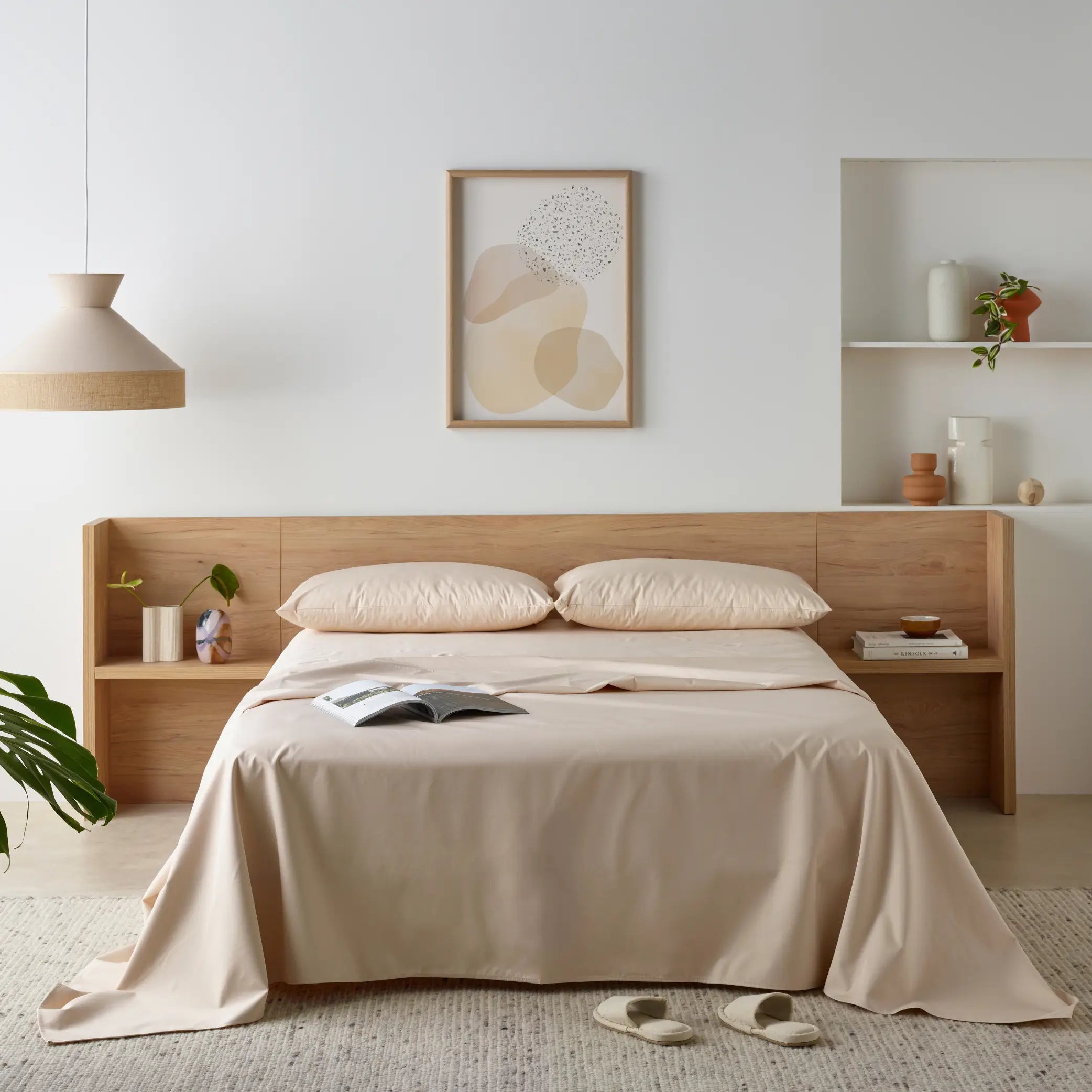 Elegant bedroom featuring a waterproof bamboo sheet set in a soft neutral tone. The breathable, hypoallergenic sheets provide a silky feel while protecting the mattress from spills and stains.