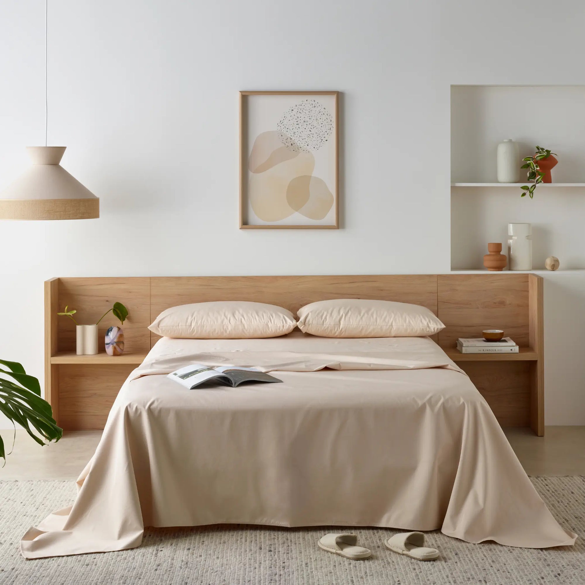 Elegant bedroom featuring a waterproof bamboo sheet set in a soft neutral tone. The breathable, hypoallergenic sheets provide a silky feel while protecting the mattress from spills and stains.