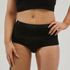 Close-up of a model wearing StayDry women's full brief underwear in black, designed for incontinence protection with waterproof and absorbent layers. Comfortable, high-waisted fit for maximum coverage and leak-proof confidence.