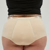 Back view of StayDry full brief underwear in skin tone, featuring a high-waisted, waterproof, and absorbent design for superior incontinence protection and all-day comfort.